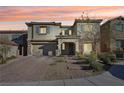 Two-story house with stone accents and a landscaped front yard at 996 Alverstone Ct, Henderson, NV 89002