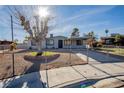 Updated single story home with carport and landscaped front yard at 6121 Denver Cir, Las Vegas, NV 89107