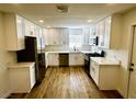 Modern kitchen with white shaker cabinets, quartz countertops, and stainless steel appliances at , Las Vegas, NV 89121