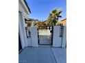 Black metal gate provides access to the side yard at , Las Vegas, NV 89147