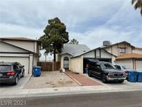 Two-story home with attached garage and driveway at 6732 Accent Ct, Las Vegas, NV 89108