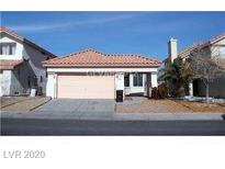Single-story home with terracotta roof and attached garage at 6520 Lombard Dr, Las Vegas, NV 89108