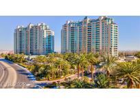 Luxury highrise building with palm trees and a resort-style feel at 9101 Alta Dr # 204, Las Vegas, NV 89145