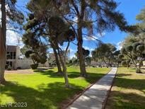 Landscaped grounds with walking path, offering a serene community atmosphere at 750 S Royal Crest Cir # 315, Las Vegas, NV 89169