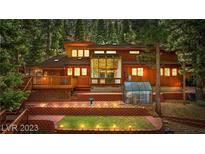 Rustic wood home with deck and solarium at 4095 Tyrol Way, Mount Charleston, NV 89124