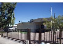 Single story home with gated driveway and landscaping at 2301 S 17Th St, Las Vegas, NV 89104