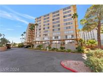 Multi-story building with parking and landscaping at 205 E Harmon Ave # 220, Las Vegas, NV 89169