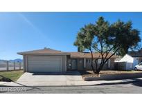 Single-story house with attached garage at 4999 Nellis Cir, Las Vegas, NV 89120