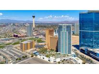 Aerial view of a modern highrise building in a vibrant city, showcasing the surrounding landscape and amenities at 2700 Las Vegas Blvd # 4003, Las Vegas, NV 89109