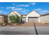 Modern farmhouse style home with two-car garage and landscaping at 8977 Coastal Oaks St, Las Vegas, NV 89166