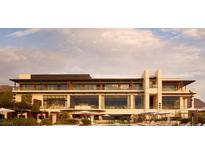 Luxury home with expansive windows, balconies, and a resort-style pool at 11660 Summit Club Dr # 212, Las Vegas, NV 89135