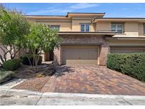 Two-story home with brick facade and attached garage at 10362 Addie De Mar Ln, Las Vegas, NV 89135