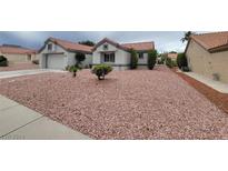 Single-story home with a desert landscaping and attached garage at 9004 Pennystone Ave, Las Vegas, NV 89134