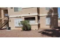 Exterior view of a building with stairs and a small yard at 1830 N Pecos Rd # 138, Las Vegas, NV 89115