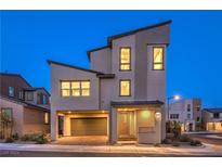 Contemporary three-story home with modern design and attached garage at 642 Angel Aura St, Las Vegas, NV 89138