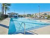Modern rectangular pool with plenty of lounge chairs at 25 Barbara Ln # 62, Las Vegas, NV 89183