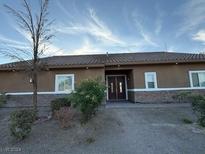 Ranch style home with simple exterior and landscaping at 2085 Saratoga St, Las Vegas, NV 89146