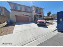 Two-story house with attached two-car garage at 7349 Dolphine Crest Ave, Las Vegas, NV 89129