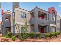 Two-story building with red accents and landscaping at 8600 W Charleston Blvd # 2056, Las Vegas, NV 89117