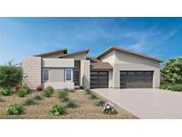 Modern single-story home with attached two-car garage and desert landscaping at 137 Tre Pietre St, Henderson, NV 89011