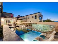 Private pool with water features and lounge chairs at 2526 Veronella St, Henderson, NV 89044