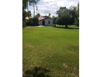 Ranch style home with a spacious lawn and mature trees at 5445 Caliente St, Las Vegas, NV 89119