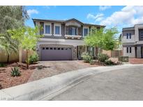 Two story home with gray siding and brick accents at 8373 Bartholomew Park Ct, Las Vegas, NV 89139