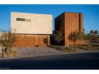 Modern home with wood and stucco exterior at 6876 Milos Rd, Las Vegas, NV 89118