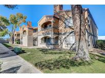 Exterior view of a two-story building with landscaping at 5220 Mission Carmel Ln # 107, Las Vegas, NV 89107