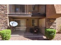 Private patio with metal railing and small table at 5295 Indian River Dr # 305, Las Vegas, NV 89103