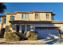 Two-story house with attached garage at 7728 Villa De La Paz Ave, Las Vegas, NV 89131