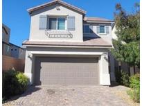 Stunning two-story home with attached garage and landscaping at 10449 Forked Run St, Las Vegas, NV 89178