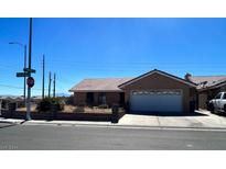 Single-story house with a two-car garage and a small front yard at 1601 Sunrise View Dr, Las Vegas, NV 89156
