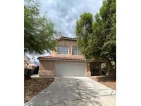 Two-story house with a large driveway at 994 River Walk Ct, Henderson, NV 89015
