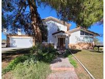 Two story house with landscaping and driveway at 2784 Belcastro St, Las Vegas, NV 89117