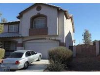 Two-story house with attached garage and landscaping at 780 Vortex Ave, Henderson, NV 89002