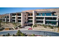 Luxury condo building with modern design and mountain views at 11665 Summit Club Dr # 103, Las Vegas, NV 89135