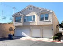Three-unit building with attached garages and ample parking at 5420 Stacked Chips Rd # 101, Las Vegas, NV 89122