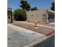 Tan colored stucco building with a garage at 4217 Park Ct, Las Vegas, NV 89110