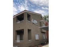 Two-story building with balconies and desert landscaping at 4730 E Craig Rd # 2093, Las Vegas, NV 89115