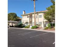 Condo building with parking and landscaping at 1409 Cedar Rock Ln # 101, Las Vegas, NV 89128