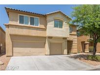 Two-story house with beige exterior and two-car garage at 3639 Bufflehead St, Las Vegas, NV 89122