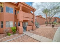 Exterior view of a two-story building with walkways at 813 Mesquite Springs Dr # 101, Mesquite, NV 89027