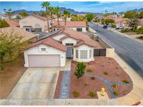 One-story house with a nicely landscaped yard and driveway at 985 River Walk Ct, Henderson, NV 89015