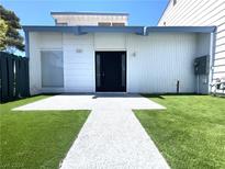 Front view of a single-Gathering home with artificial turf at 4281 White Sands Ave, Las Vegas, NV 89121