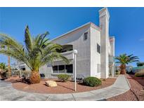 Condo building exterior showcasing Spanish-style architecture and landscaping at 2725 S Nellis Blvd # 2023, Las Vegas, NV 89121