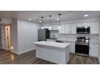 Modern kitchen with stainless steel appliances and island at 5170 River Glen Dr # 244, Las Vegas, NV 89103