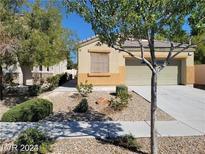 One-story house with attached garage and landscaped front yard at 3656 Bella Legato Ave, North Las Vegas, NV 89081