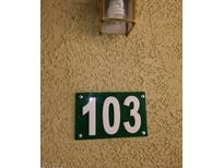 Green sign indicating unit number 103 at 1501 Linnbaker Ln # 103, Las Vegas, NV 89110