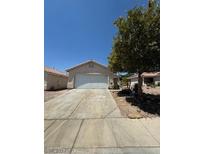 Single-story house with a two-car garage and driveway at 5523 Jose Leon St, North Las Vegas, NV 89031